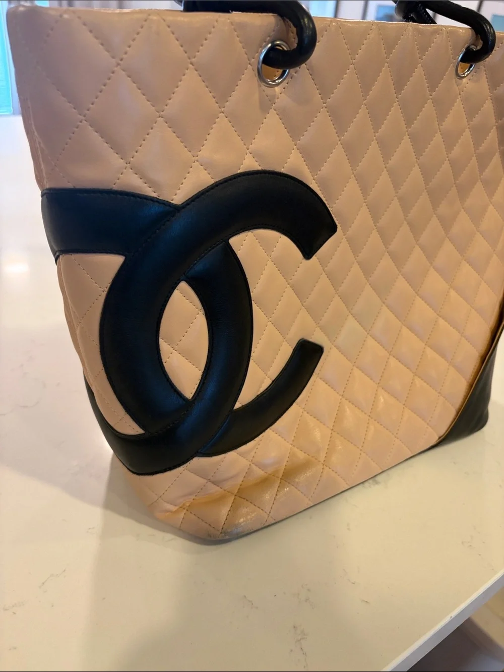 CHANEL Beige Quilted Tote with Black Accents